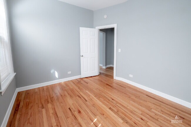 Building Photo - Modern 4BR Apartment with Hardwood Floors, Balcony & Central A/C