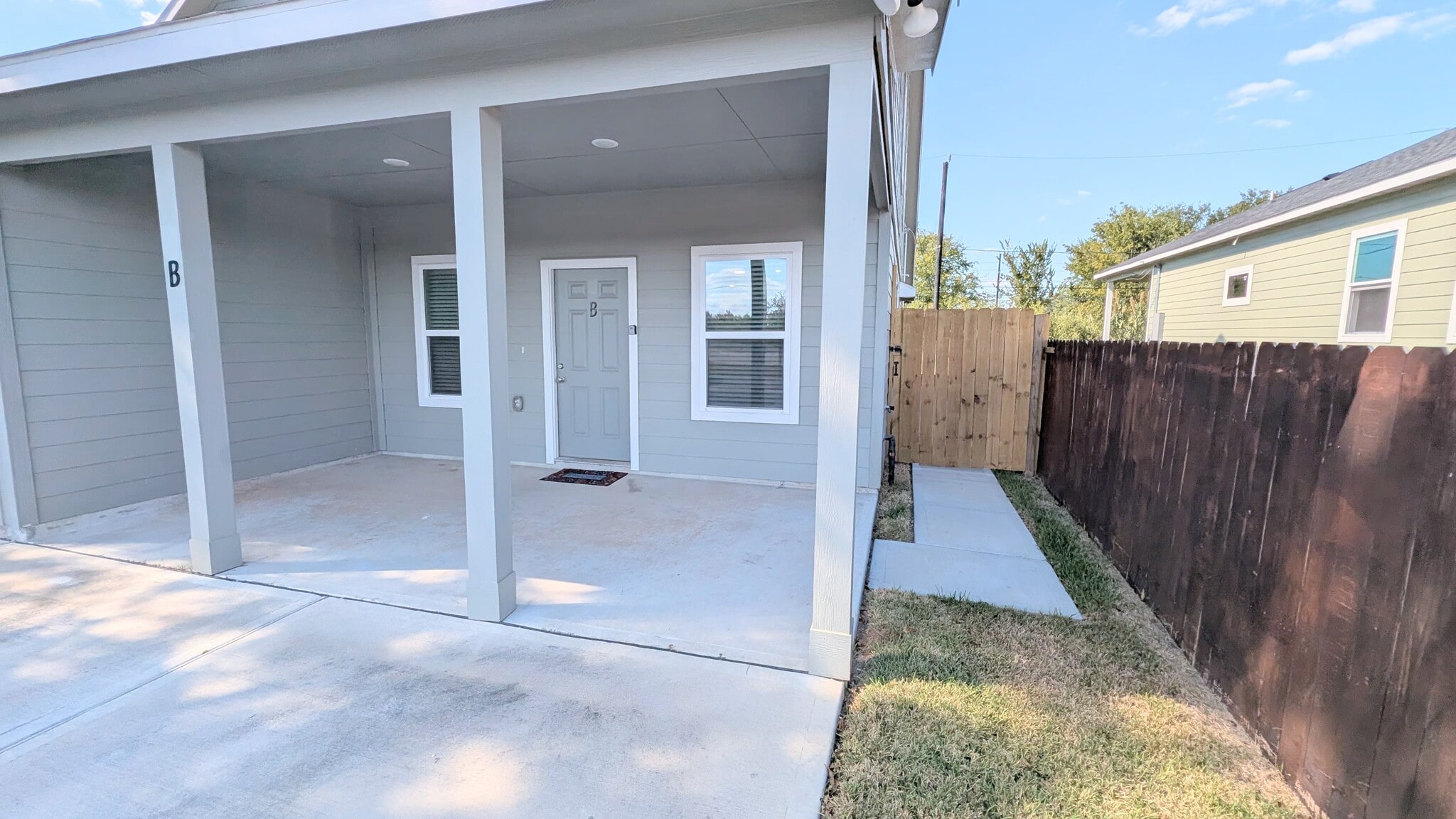 Easy access to the fully fenced backyard. - 13218 HP Johnson St