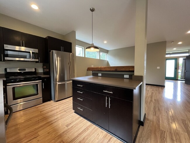 Building Photo - Charming 3 Bedroom, 2.5 Bathroom Home with Large Living Room, Tall Windows, Island Kitchen, and A...