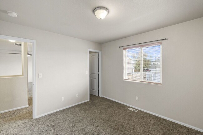 Building Photo - Spacious 4-Bedroom Home with Loft, Solar & Fenced Backyard