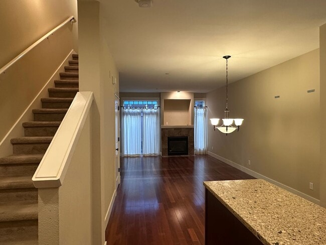 Building Photo - Stunning Tri-Level Condo with Open Concept Layout, Loft, and Private Patio!