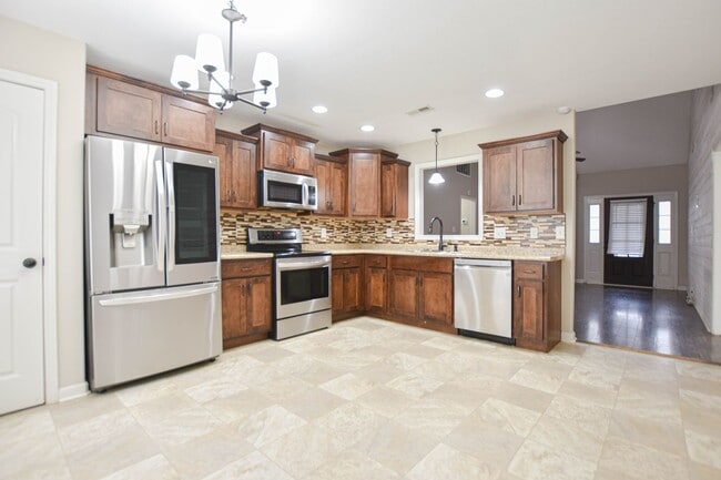 Building Photo - Pet Friendly Three Bedroom with Bonus!