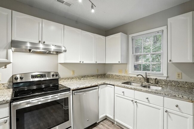 Building Photo - Spacious 2-Bedroom, 2.5-Bath End-Unit Town...