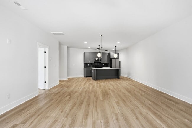 Building Photo - Bright, Open & Exceptionally Large—Your Ideal 2-Story Townhome