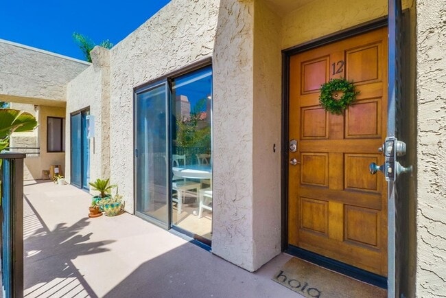 Building Photo - Stunning 2 bed 2 bath top floor condo in gated community with 2 covered parking spaces!