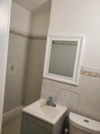 first floor bathroom with tub - 1131 W 17th St