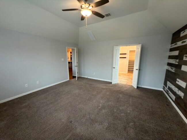 Building Photo - Four bed two bath on a corner lot with a pool in Sunfield. Gas cook top, double ovens. Open kitch...