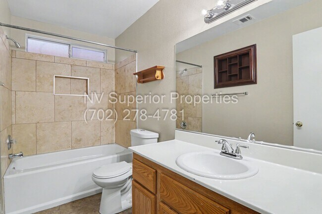 Building Photo - NW!! 4 bedrooms!! Bed & Bath DownStairs!!! RV Parking!!! Synthetic Grass Front yard!! Real Grass ...