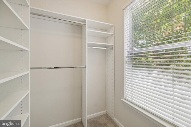Building Photo - This townhouse style condo is located across the street from the Vienna Metro Station (Orange Line).