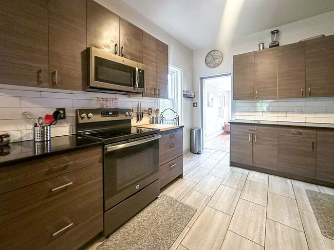 Building Photo - A home where old-world charm meets modern sophistication!