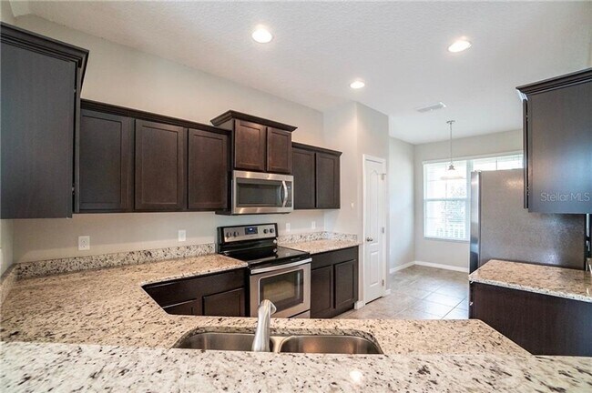 Building Photo - MOVE IN SPECIAL- 3/2.5 Beautiful Energy Efficient Townhome in St. Cloud