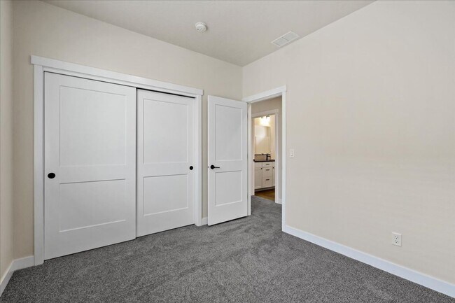 Building Photo - Brand New, Stylish 4-Bedroom Home with Vaulted Ceilings and Private Patio