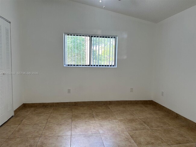 Building Photo - 9491 Palm Cir S