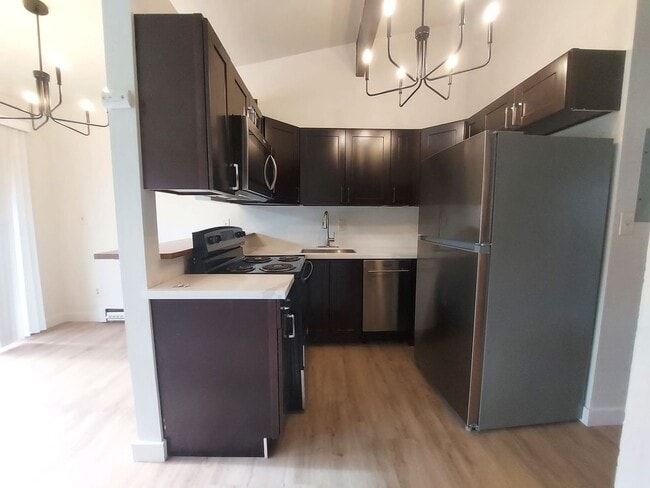 Building Photo - North Seattle 1BR with Private Balcony, Natural Light, and Modern Flooring