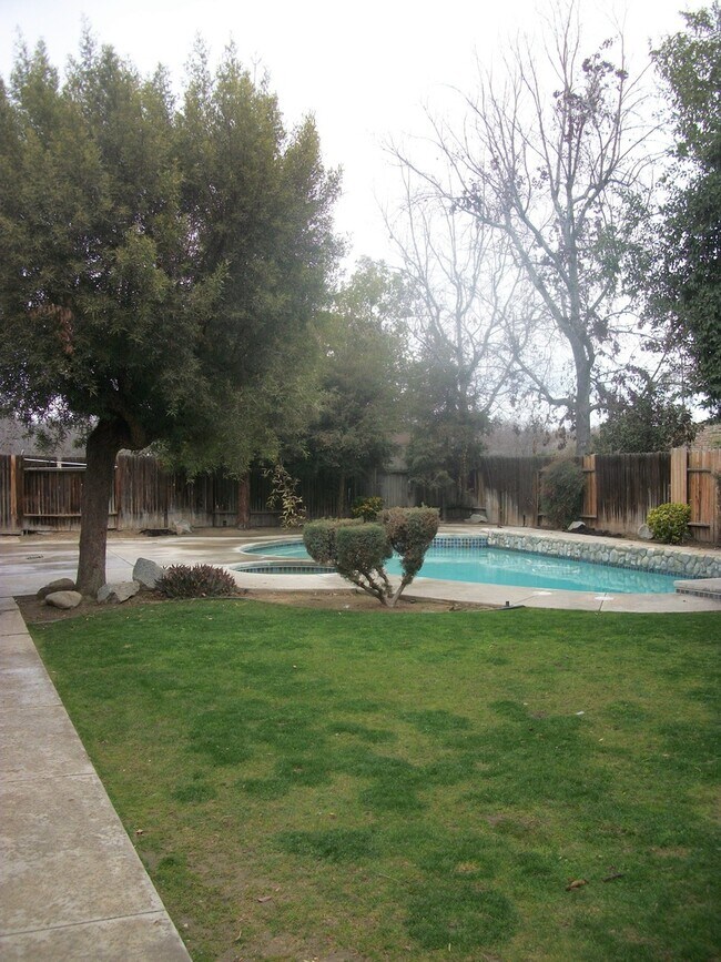 Building Photo - Coming Soon: Spacious Renovated 3 Bedroom Rosedale Home with Pool, Dual Fireplaces & Covered Patio