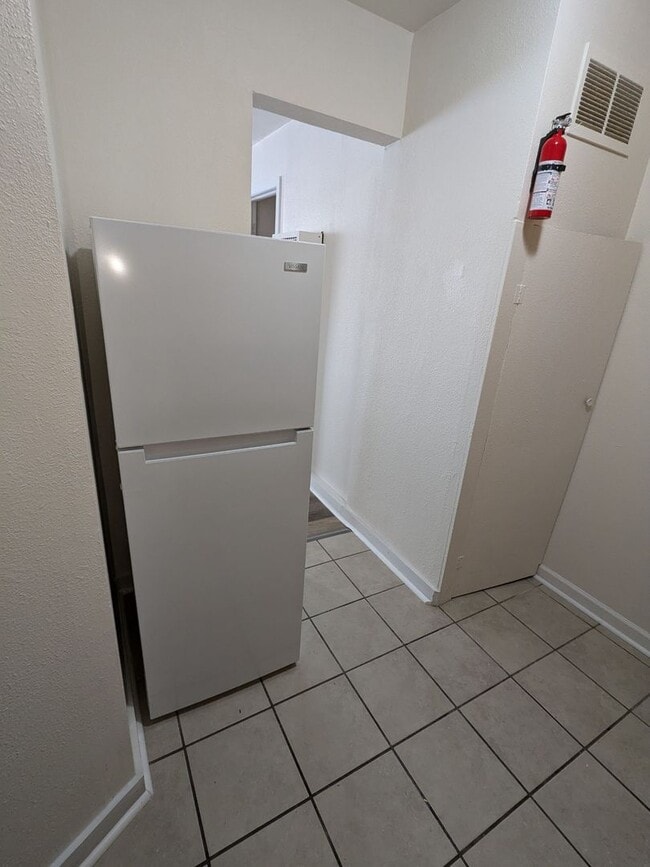 Building Photo - Ground Level 2 Bedroom, 2 Bath apartment. New flooring and paint. Tenant pays electric and natura...