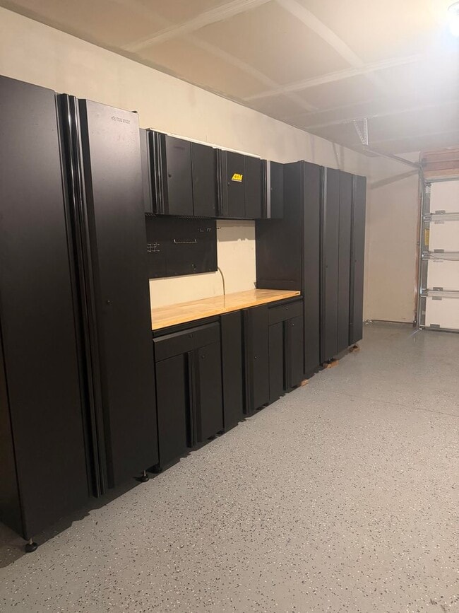 Building Photo - Lots of storage space in this 4- Car garage for all your playthings!!