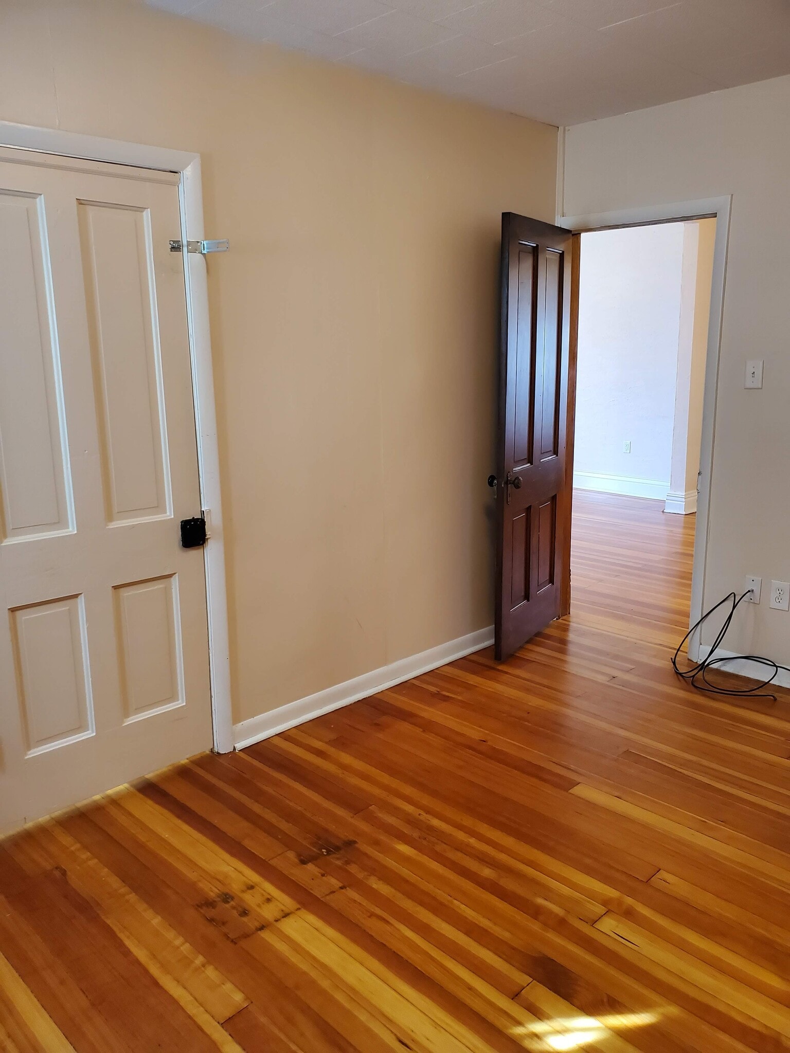 Middle bedroom with view of closet and entry door - 607 Harrison Ave