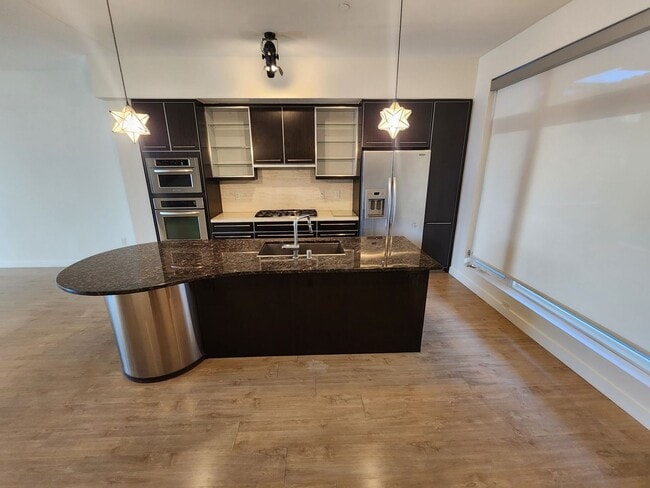 Building Photo - Exceptional Two Level 3 bedroom Condo in upscale Luxe Lofts