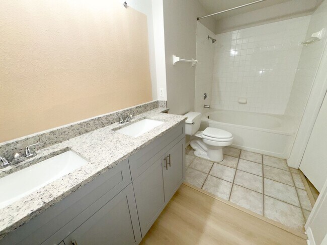 Building Photo - NEW-Remodeled bathroom & kitchen! NEW VINYL PLANK flooring & fresh paint! 2 bedroom 1 bath condo ...