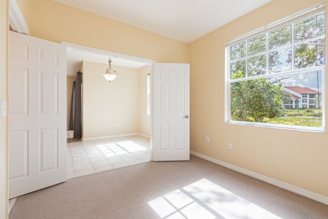 Building Photo - Ground-Level Comfort in North Naples – 2BR Condo in Fairway Preserve at Olde Cypress