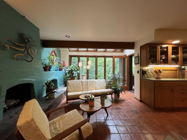 Building Photo - One-of-a-Kind Custom Home with Wall of Windows, Stone Fireplaces, Expansive Entertainment Space &...