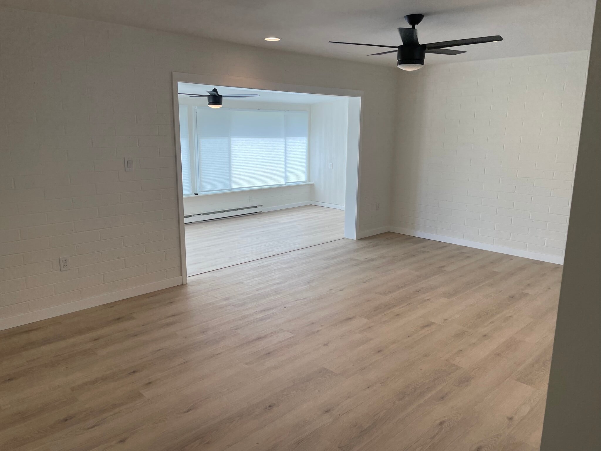 Living room looking towards the Arizona room and golf course - 11227 N Coggins Dr