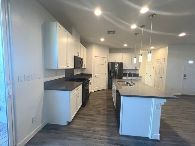 Building Photo - Single-story 1326 sq ft, townhome built in 2019 w/3 bed, 2 bath & spacious attached 2-car garage ...