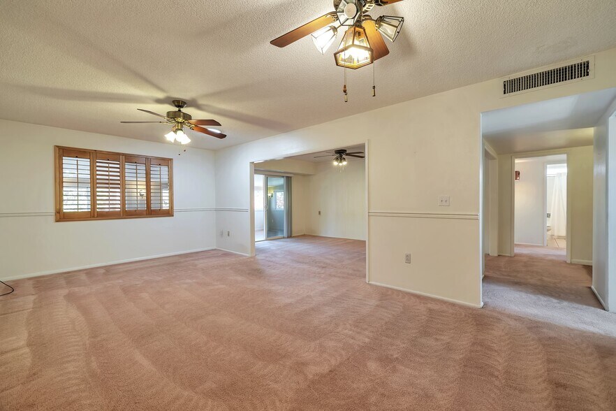Living oom looking back into Family Room and Hallway - 11040 W Salem Dr