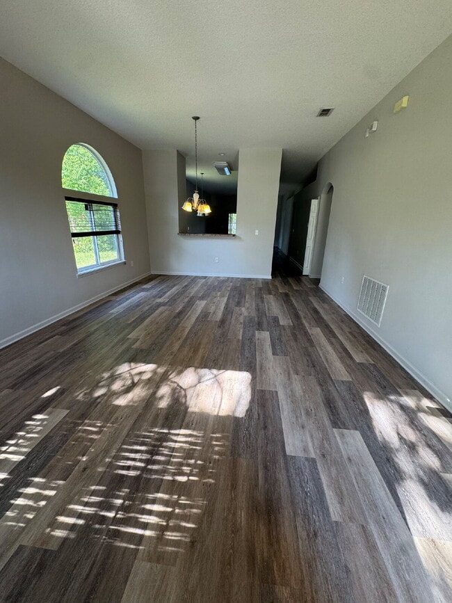 Building Photo - Spacious 4 Bedroom Pond-View Home with Upg...