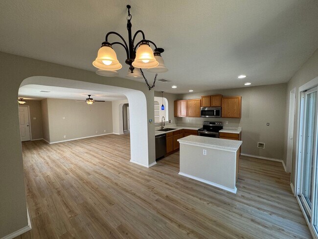 Building Photo - NEW PAINT, FLOORING, APPLIANCES & ROOF  | ...