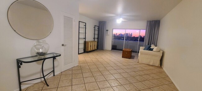 Living Room with CB2 glass shelves and console that will accommodate a 50" television. - 3 Island Ave