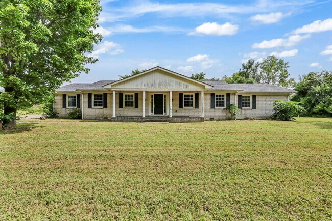 Building Photo - spacious 4-bedroom, 2.5-bath home featuring a 2-car garage and fresh updates throughout.