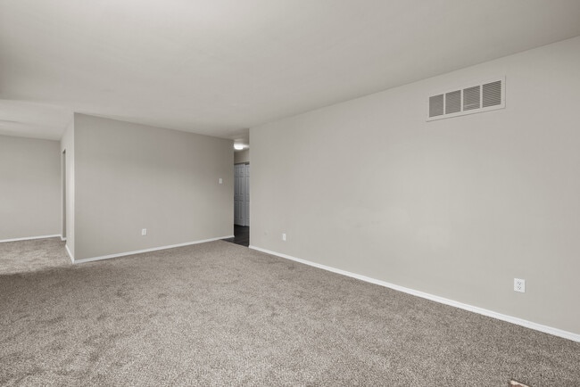 Two Bedroom Garden Remodel with Fireplace | Living & Dining Space - Woods Mill Park Apartments & Townhomes
