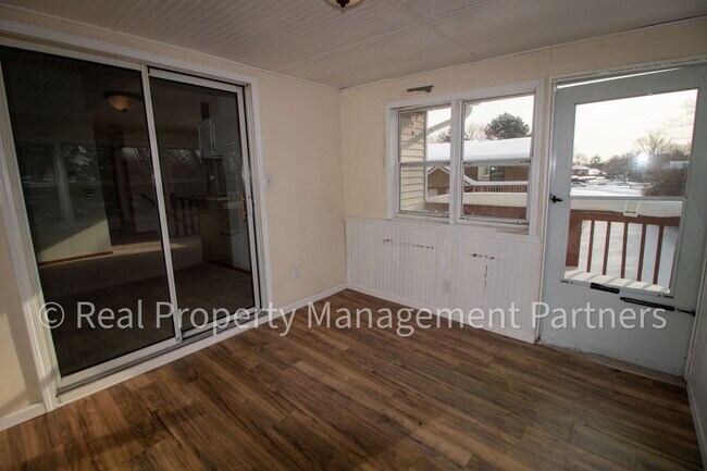 Building Photo - 2-Bed, 1-Bath Upper Unit with Garage & Porch – Steps from Paul Henry Trail