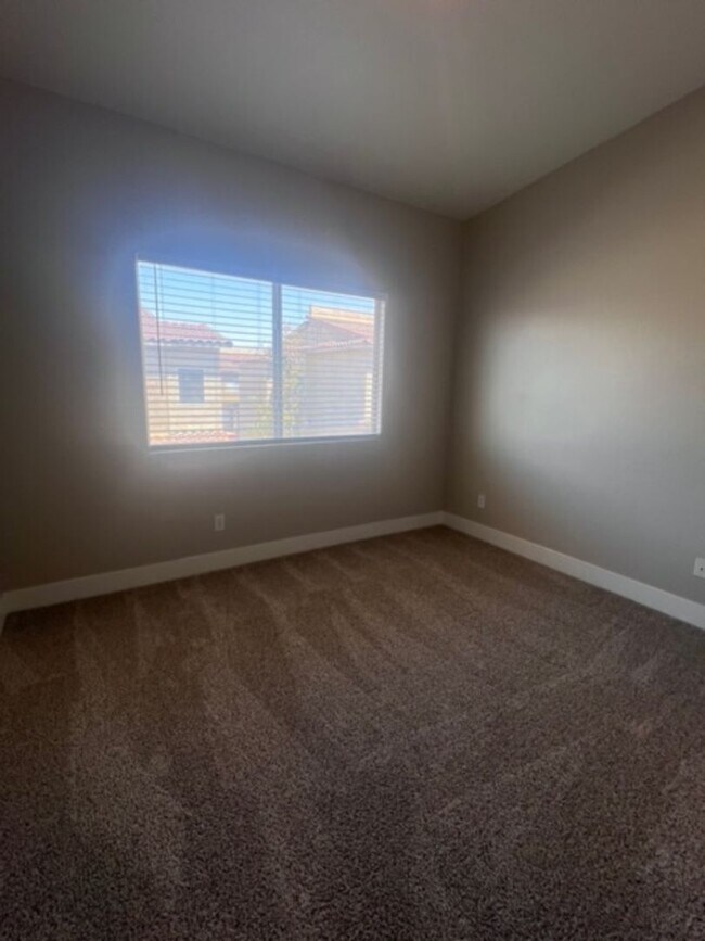 Building Photo - Three bedroom townhouse with 2 car garage
