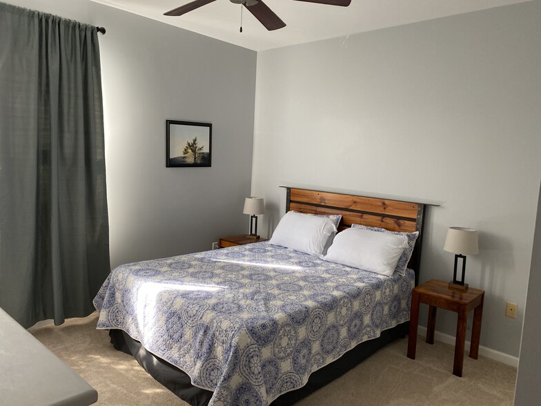 Inviting Bedroom with queen bed, two nightstands, lamps, two closets, dresser - 735 Walker Square