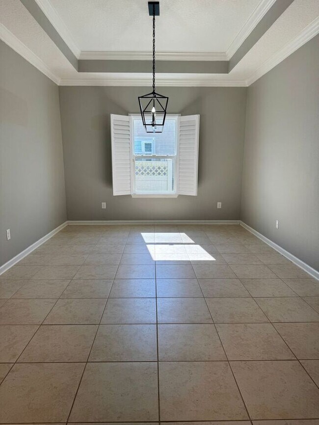 Building Photo - COMING SOON! Beautiful 4BR 3BA Home w/ Screened Lanai & Pond View • Garage Parking • Fenced Yard ...