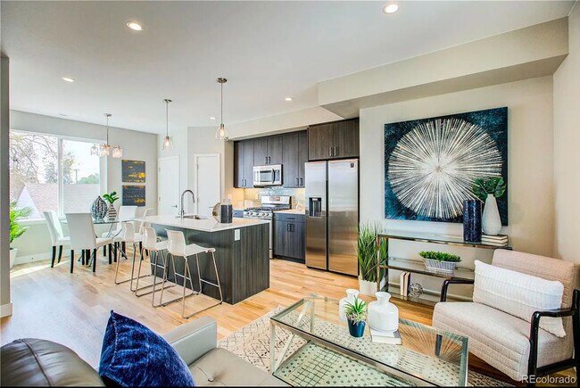 Embrace contemporary living in this beautifully furnished and bright open-concept space. - Harley House