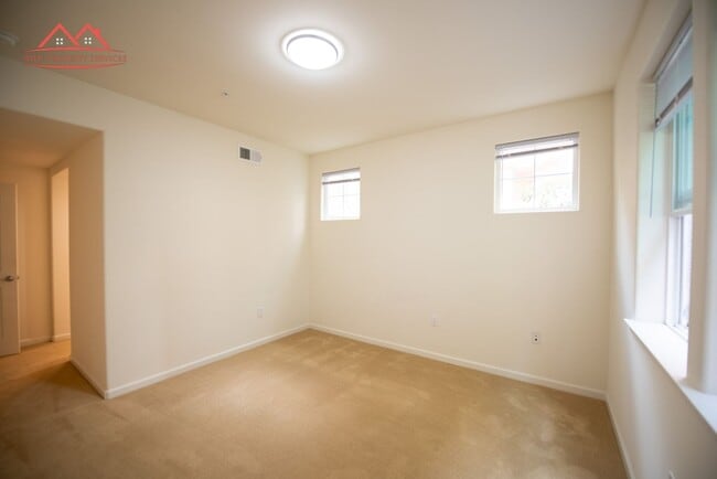 Building Photo - Charming 1 Bedroom/1 Bath Condo with Private Backyard & Double Parking Spaces