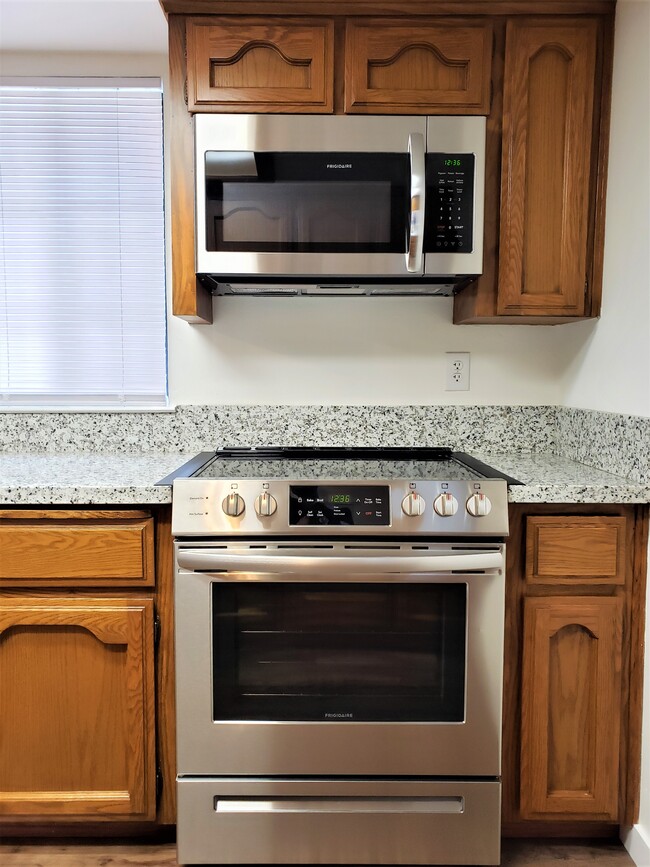 Stainless Stove and Microwave - 4617 N Charles Ave