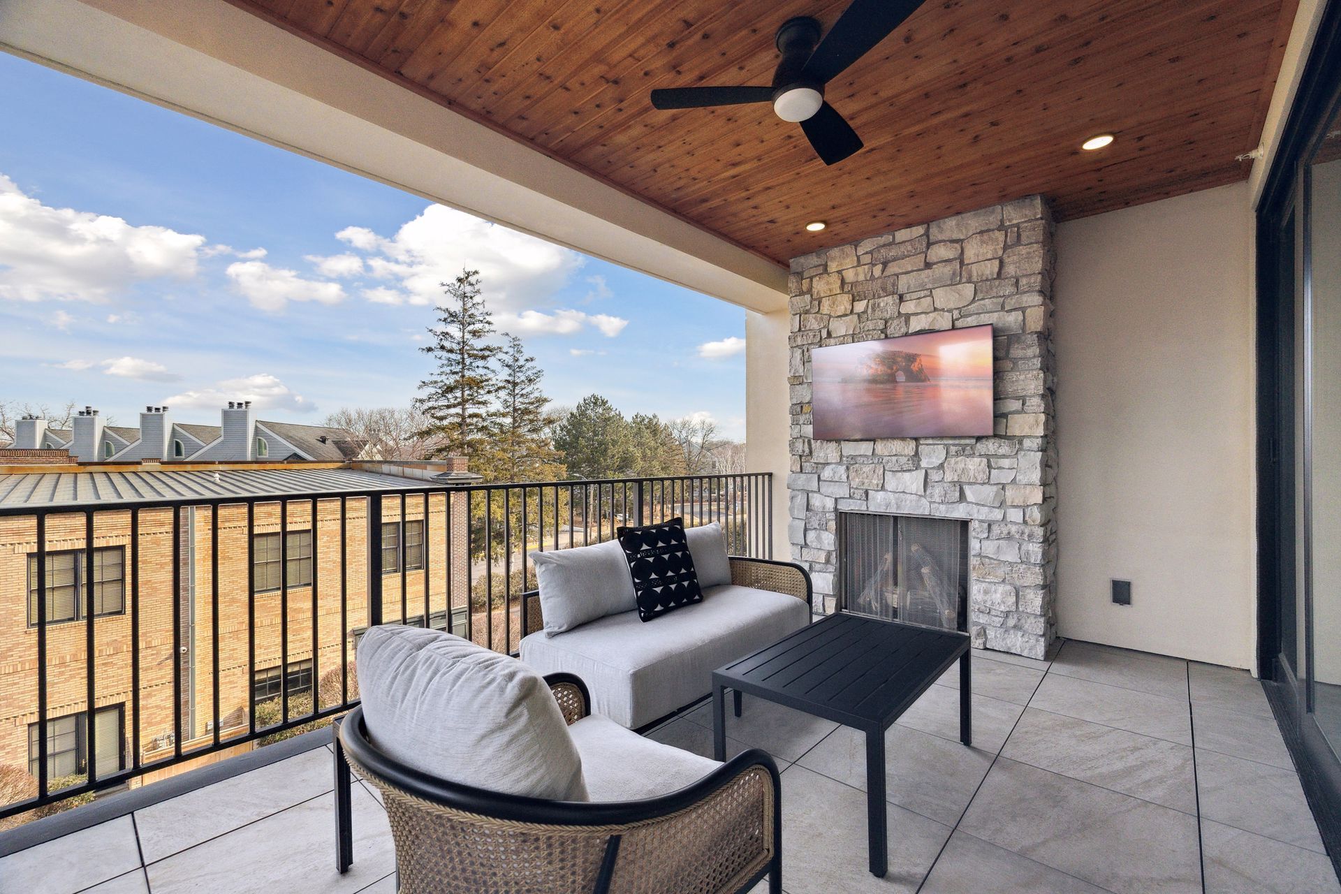 Gas fireplace and cedar ceiling are features of the covered balcony space - 511 2nd St