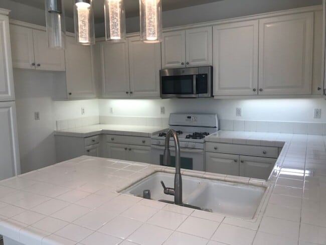 Building Photo - Ready Now! Beautiful Gated Riverside 4bed 2.5bath Home!!