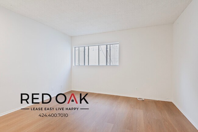 Building Photo - Charming One Bedroom with Sunlit Open Floo...