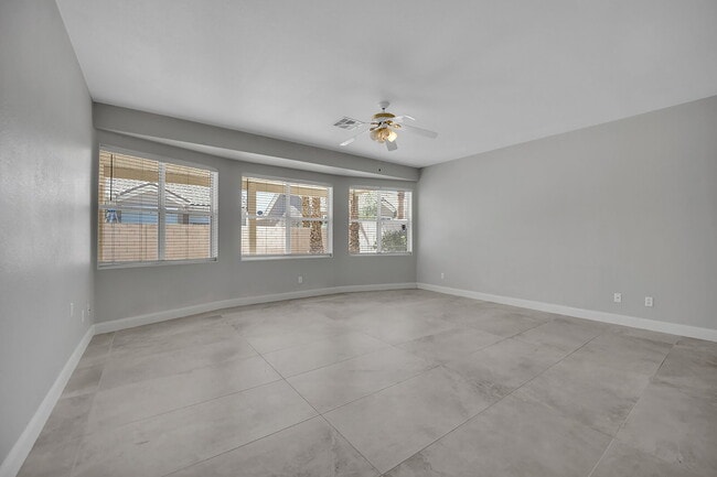 Building Photo - Spacious 4-bedroom, 3-car garage home feat...