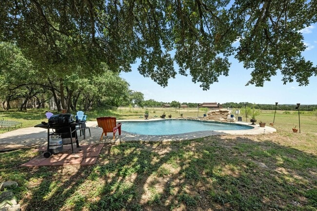 Building Photo - Serene Oasis on Nearly 2 Acres With a Pool!!