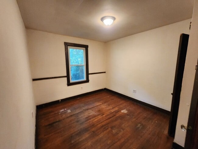 Building Photo - 4 BR home with first-floor living, new roof, and a private-feeling backyard in Lincoln Place