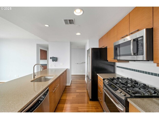 Building Photo - Modern 2-Bed/2-Bath Condo with Balcony & Prime Downtown Location