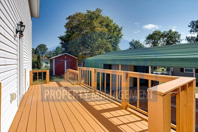 Building Photo - Updated house with carport and shed on corner lot!