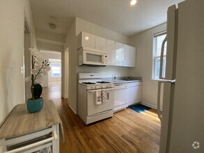 Spacious kitchen with hardwood floors - 2834-2838 Orchard